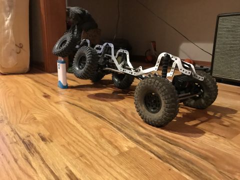 1989 Ford Bronco - This RC crawler chassis features a multi-link suspension and large, off-road tires, suggesting it is built for terrain.