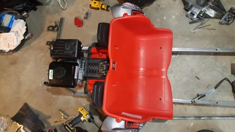 2007 Subaru Impreza - Go-kart frame and engine assembly, with various tools and parts visible on the floor.