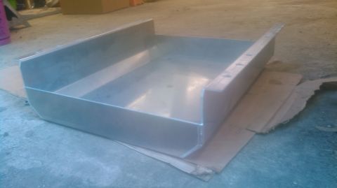 1992 Ford Bronco - A metal pan is shown from an angled perspective.