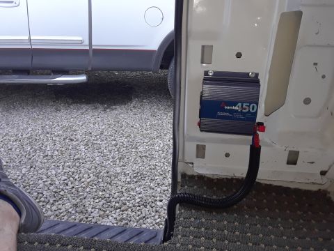1999 Ford E250 - Samlex 450 power inverter installed inside a van's cargo area.