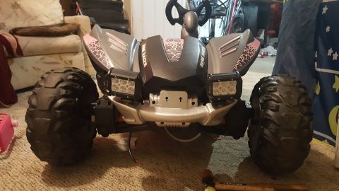 2007 Subaru Impreza - This toy dune buggy features a pink and silver body, large off-road tires, and auxiliary LED lighting.