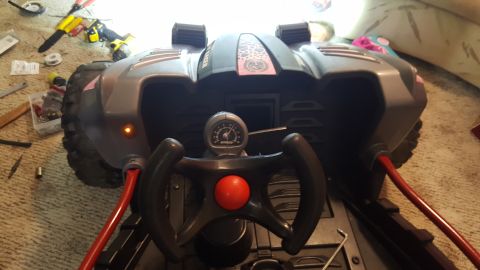 2007 Subaru Impreza - Interior view of a toy dune buggy, a steering wheel, a gauge, and red accents.