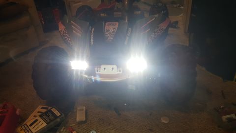 2007 Subaru Impreza - Off-road vehicle with bright headlights and "DUNE RACER" graphics on its body panels.