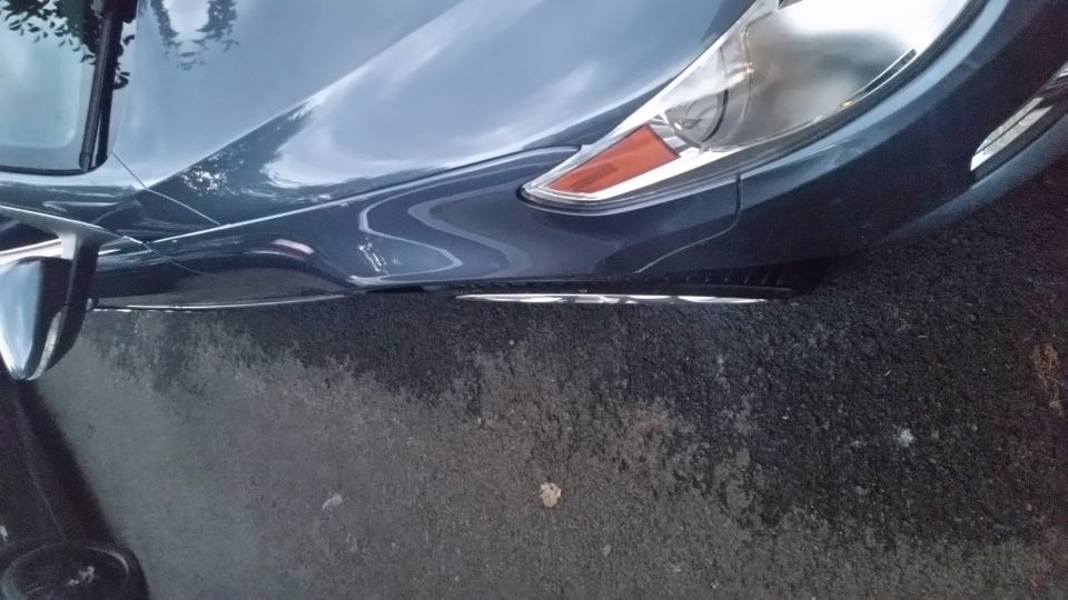 Dark blue car front corner, 2010 Volkswagen Passat