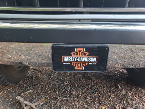 1989 Ford Bronco - A close-up view of a vehicle's bumper and license plate frame.