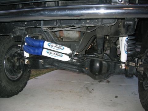 1989 Ford Bronco - Close-up view of rear axle and suspension components, including new shocks.