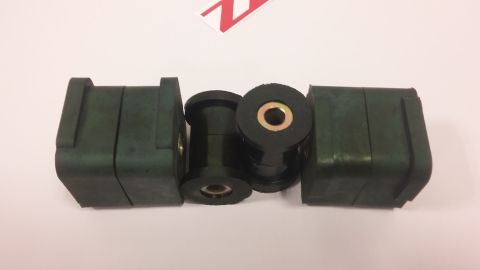 2000 Pontiac Grand Prix - Set of four suspension bushings with metal inserts, likely for a vehicle's suspension system.