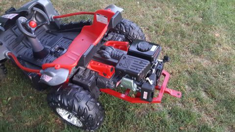 2007 Subaru Impreza - Go-kart with exposed engine and red seat, viewed from the side. Supermotors.net logo is present.