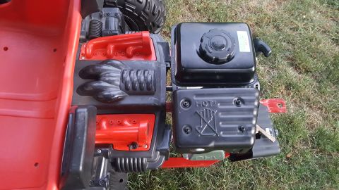 2007 Subaru Impreza - Close-up of a toy vehicle's engine compartment, showing red plastic and black engine components.
