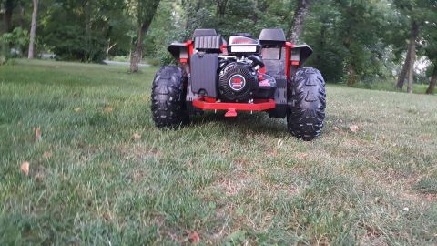 2007 Subaru Impreza - This ATV features a prominent exposed engine and tires, seen from a rear perspective in a grassy outdoor setting.