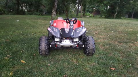 2007 Subaru Impreza - This toy dune buggy has a red body with gray accents and large off-road tires.