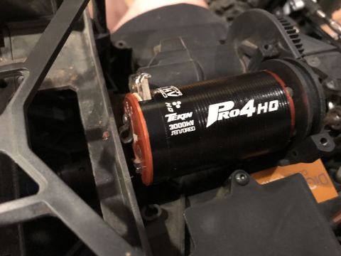 1989 Ford Bronco - Close-up of a Tekin Pro4 HD 3000KV motor, a component for an RC vehicle.