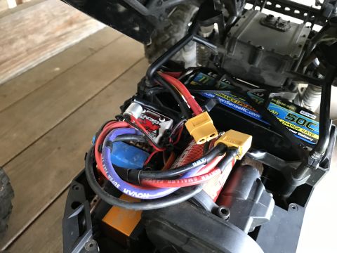 1989 Ford Bronco - The intricate wiring and battery pack of a remote control car are visible, multiple LiPo batteries and yellow XT60 connectors.