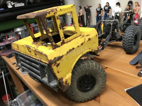 1989 Ford Bronco - This is a toy Tonka truck with a weathered yellow body and a visible chassis, wheels, and suspension components.