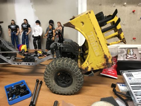 1989 Ford Bronco - A partially assembled toy truck chassis with a weathered yellow Tonka body is visible.
