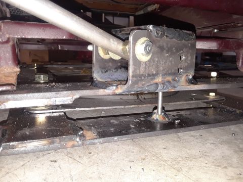 1999 Ford E250 - Custom metal bracket assembly with a rod, likely part of a suspension or support system.