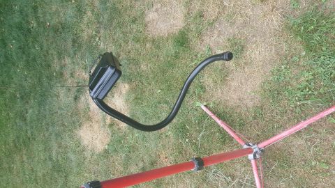2007 Subaru Impreza - A black plastic air intake hose and resonator box are laid out on a grassy surface.
