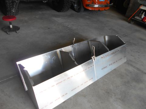 1992 Ford Bronco - A custom-made, multi-compartment aluminum box sits on a concrete floor in a garage. The box is partially assembled, with clamps holding som…