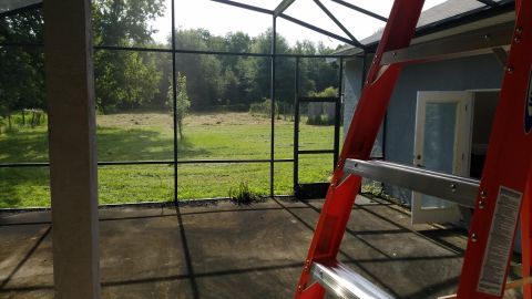 1994 Ford Bronco - Photograph of a screened patio under construction, not a technical document.