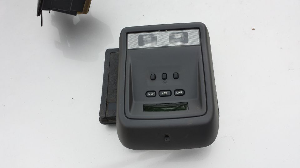 Black overhead console with lights and buttons