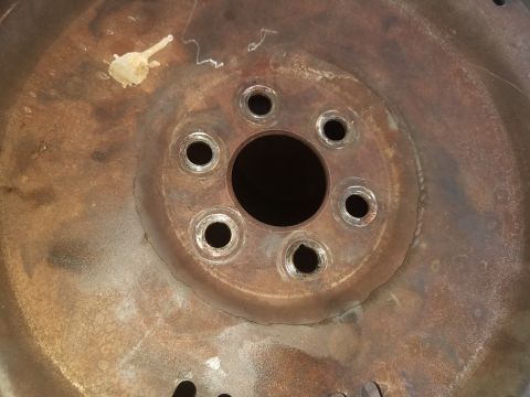 1994 Ford Bronco - Close-up of a corroded wheel hub, showing its mechanical components.