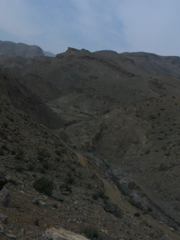 1981 Ford Bronco - A desolate mountain landscape with a winding path visible in the distance.