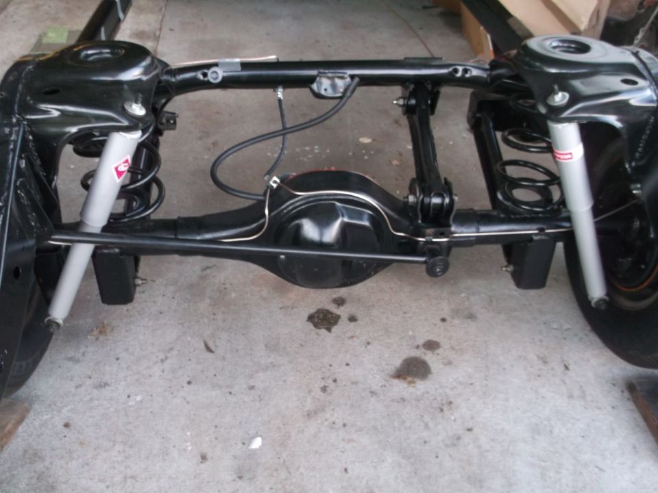 Rear suspension and differential assembly of a classic car.