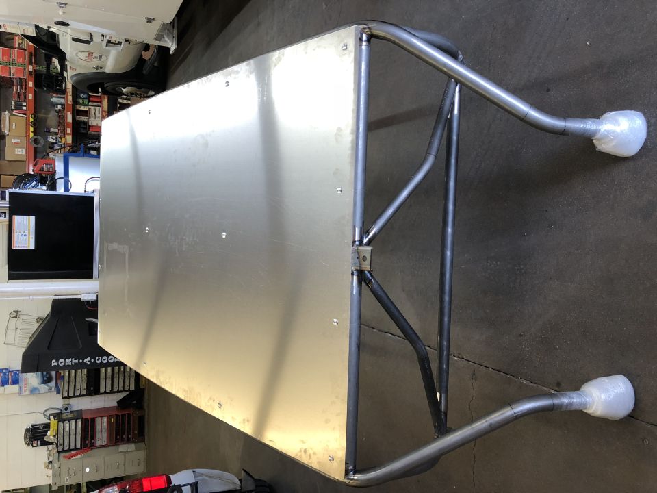 Custom metal rack with aluminum top and tubular steel frame