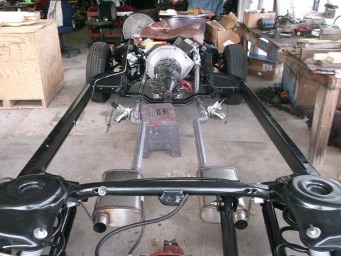 1967 Ford Galaxie - The chassis and powertrain of a vehicle are shown during a restoration or build process.