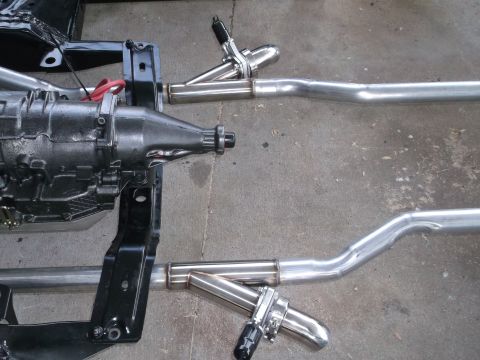 1967 Ford Galaxie - Close-up view of a car's transmission and exhaust system components.