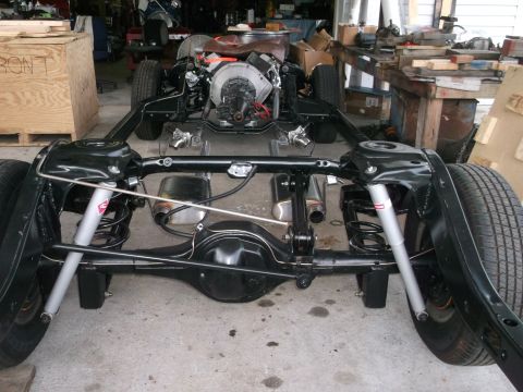 1967 Ford Galaxie - Vehicle chassis undergoing restoration or assembly, showing the drivetrain and suspension components.