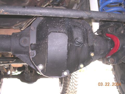 1994 Ford Bronco - Close-up of a vehicle's differential cover and suspension parts, with a date stamp of 03.22.2004.