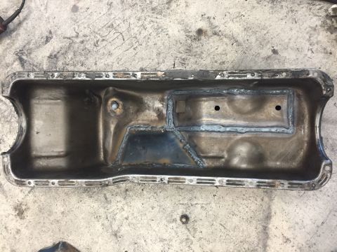 1969 Ford Bronco - This is an oil pan that has been welded internally, likely for repair or modification.