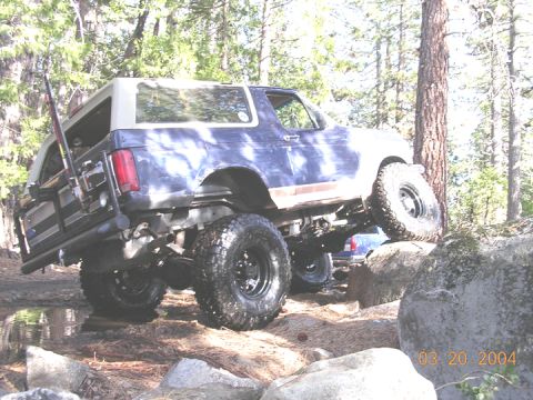 1994 Ford Bronco - This is without using the wristed arm, and the heims arent on yet. the rear shocks are way to short, but even with that, the rear tire is n…