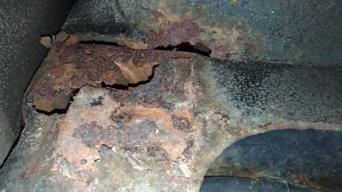 1996 Ford Bronco - Significant rust damage is visible on the vehicle's undercarriage structure.