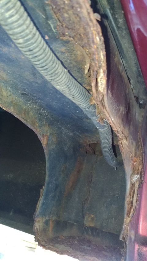 1996 Ford Bronco - Significant rust damage is visible on the vehicle's structural components, including the frame and body panels.
