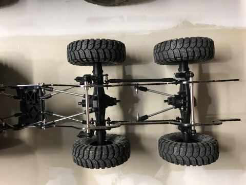 1989 Ford Bronco - Underside view of an RC car chassis with suspension and tires.