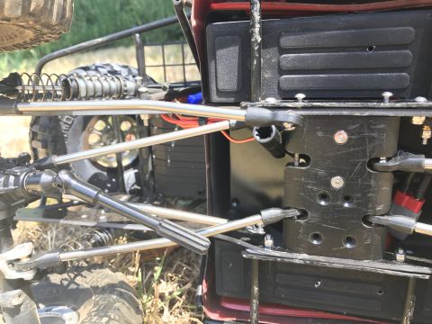 1989 Ford Bronco - Detail shot of the undercarriage and suspension system of a remote-controlled vehicle.