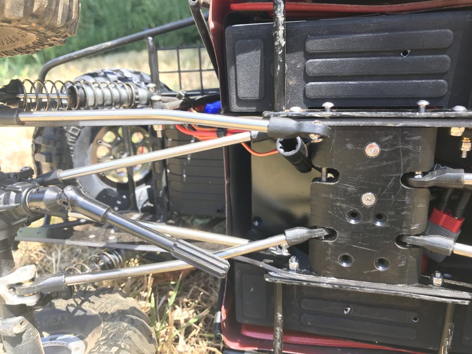 Close-up of RC car suspension and chassis components