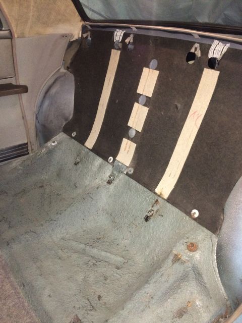1970 Ford Ranchero - The interior of a vehicle, focusing on the rear cargo area with visible carpeting and upholstery.
