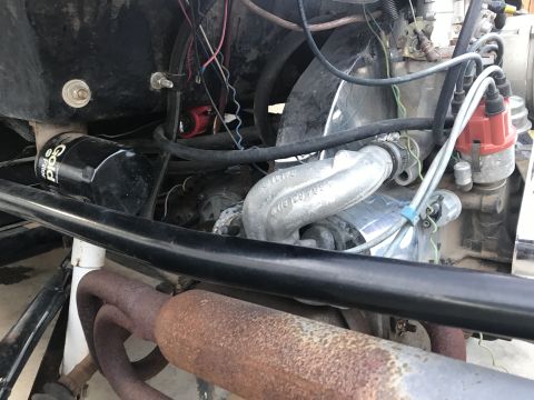1970 Volkswagen Beetle - Engine bay details including oil filter, exhaust, and distributor cap on a Volkswagen.