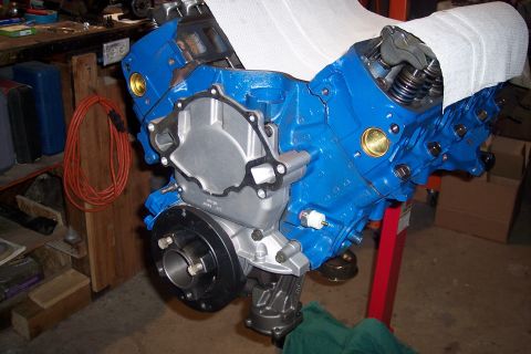 1995 Ford Bronco - Engine block assembly in a workshop setting, with tools and materials visible in the background.