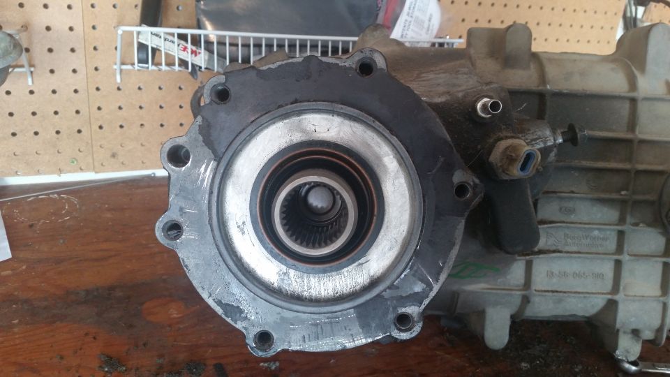 Transfer case part with splined output shaft and mounting flange