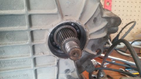 1985 Ford Bronco - A close-up view of a BorgWarner automotive component, showing a splined shaft and bearing assembly.