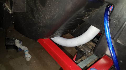 2007 Subaru Impreza - Close-up of a vehicle's underbody shows modifications with plumbing and wiring.