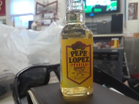 1994 Ford Bronco - Bottle of Pepe Lopez tequila is the main subject in this indoor photo.