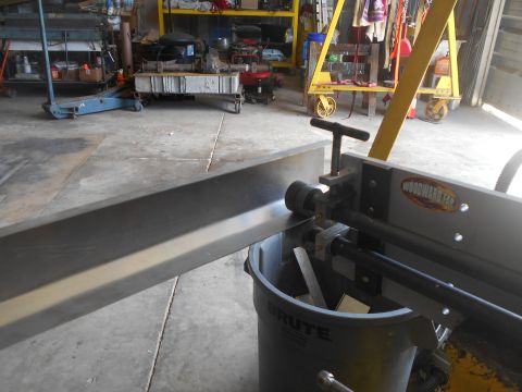 1992 Ford Bronco - A sheet metal roller, identified by the 'WOODWARD FAB' logo, is shown in a workshop setting.