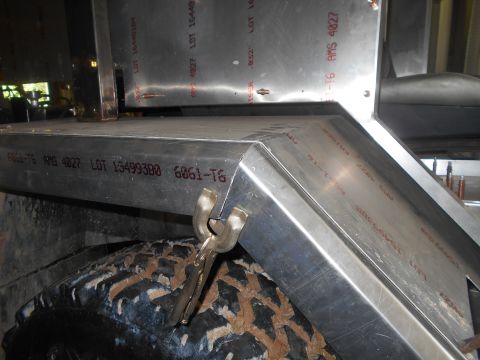 1992 Ford Bronco - Aluminum construction details are visible over a tire, with lot numbers stamped on the metal.