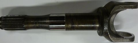 1995 Ford Bronco - A close-up view of a metal driveshaft yoke, a component of a vehicle's drivetrain.