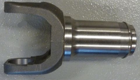 1995 Ford Bronco - A driveshaft yoke is shown, a critical component for transferring rotational power.
